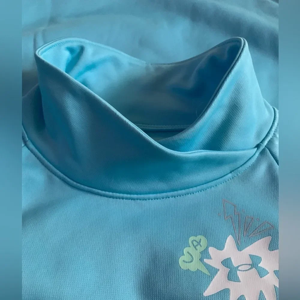 Under Armour girls sweater color baby blue. NWOT